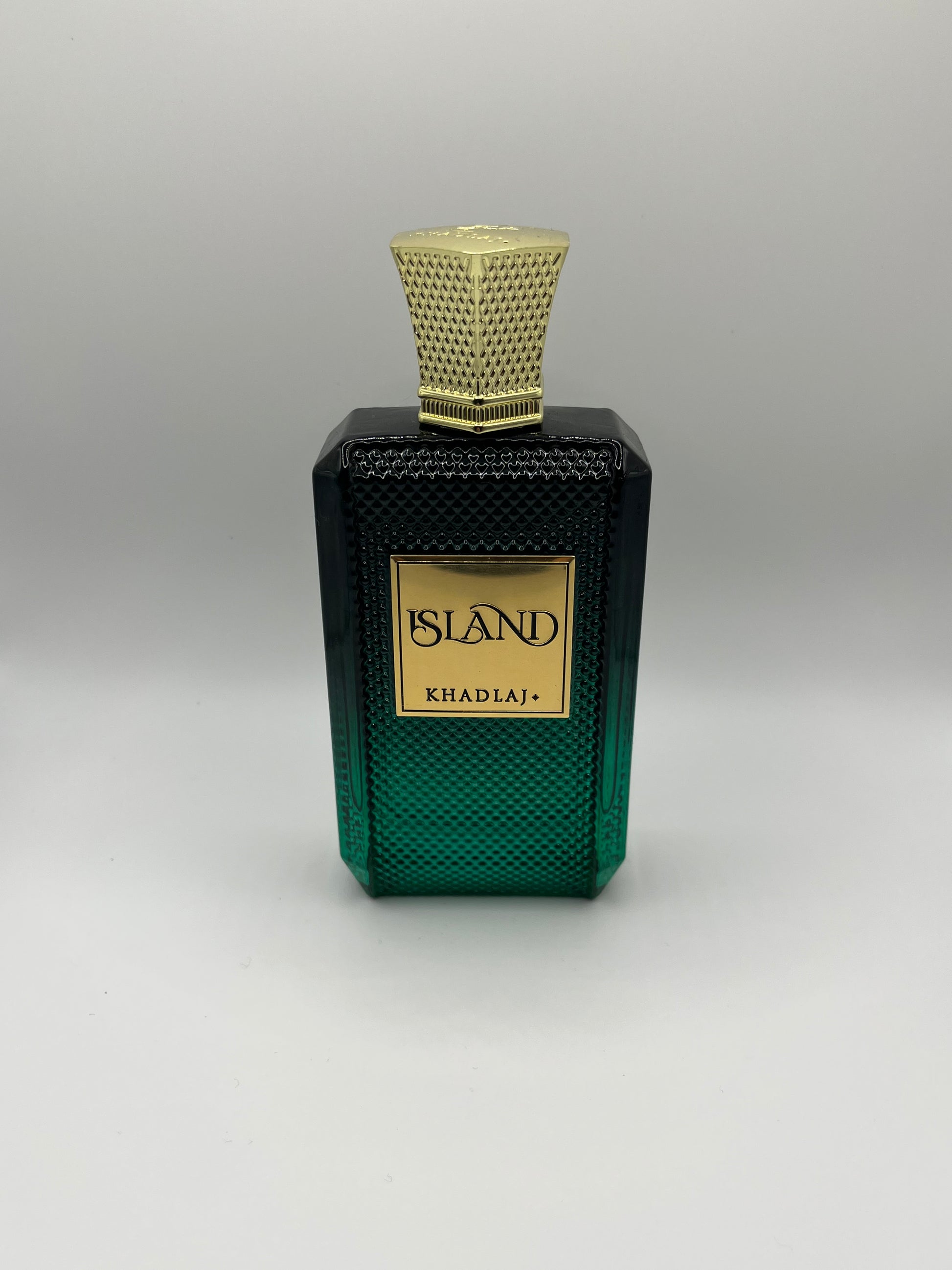 Island by Khadlaj decant – tropical woody fragrance inspired by Le Beau Le Parfum with coconut, ginger, pineapple, amber, and tonka bean.

